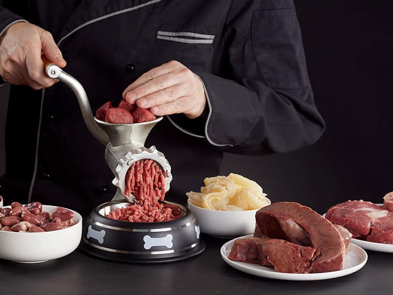 Man Preparing Meat Grinders