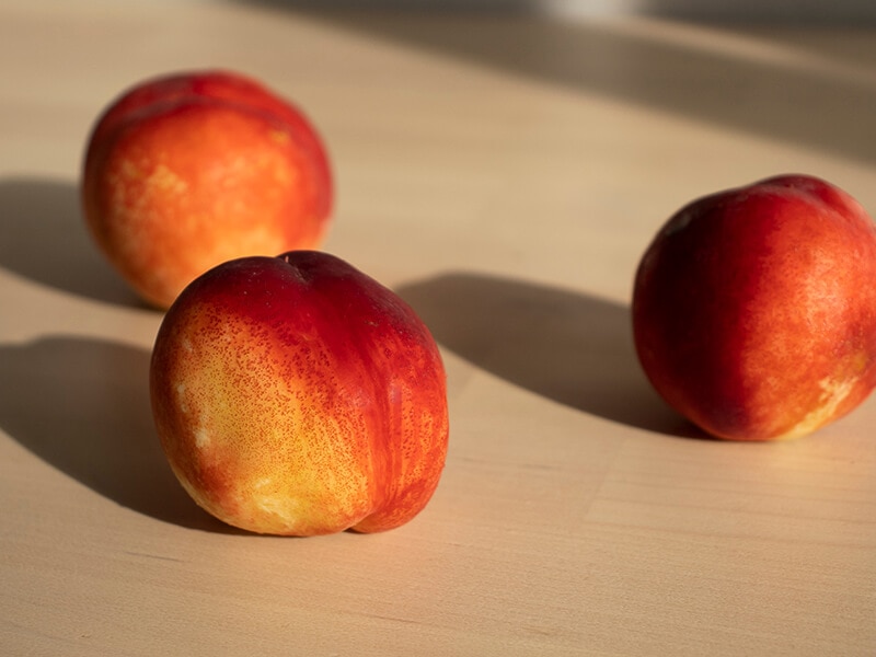 Three Ripe Nectarines Peaches