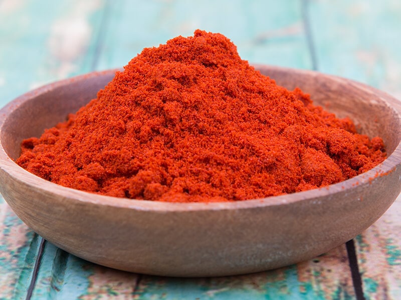 Paprika Powder in Wooden Bowl