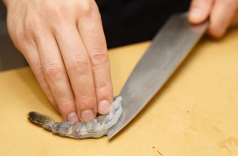 Chef Cutting Raw Shrimp