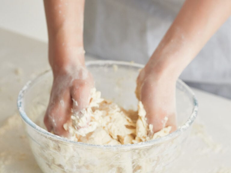 Hands Mixing Dough