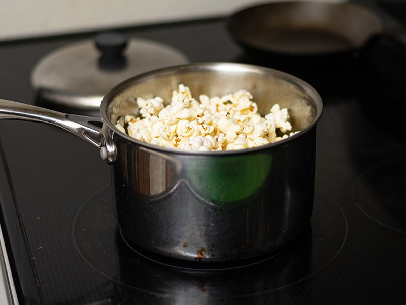 Making Popcorn By A Stove