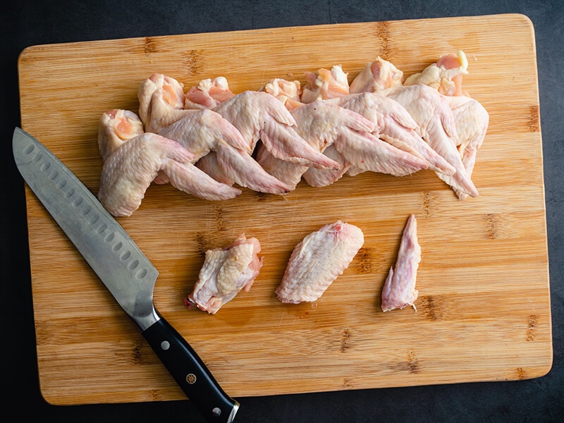 Cutting Raw Chicken Drumette