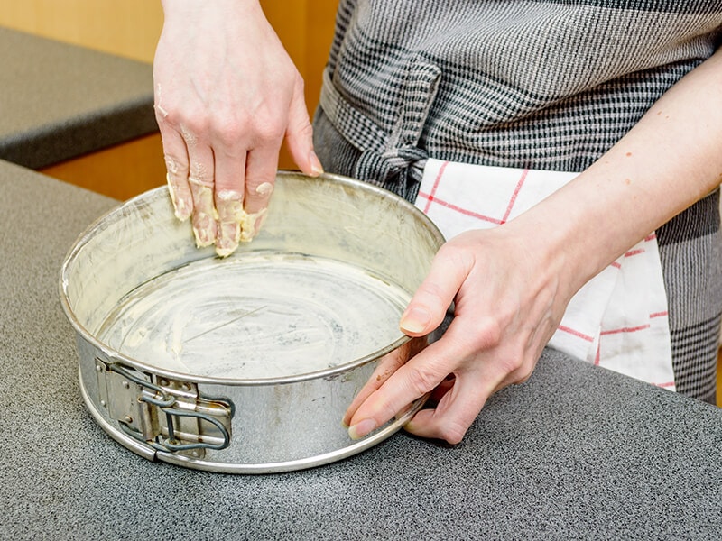 Female Hands Smearing Butter