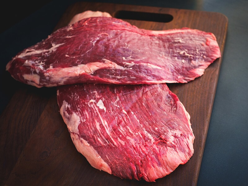 Flank Beef On Wooden Board