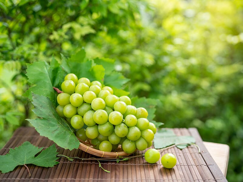 Green Grape On Bamboo Basket