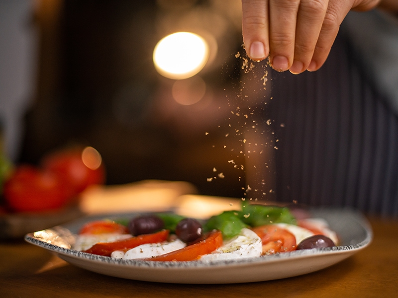 Hands Seasoning Made Salad