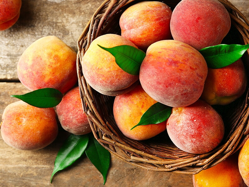 Peaches Basket On Wooden