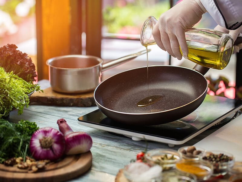 Pours Liquid On Pan