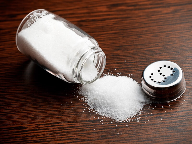 Salt Sprinkled On Wooden Table