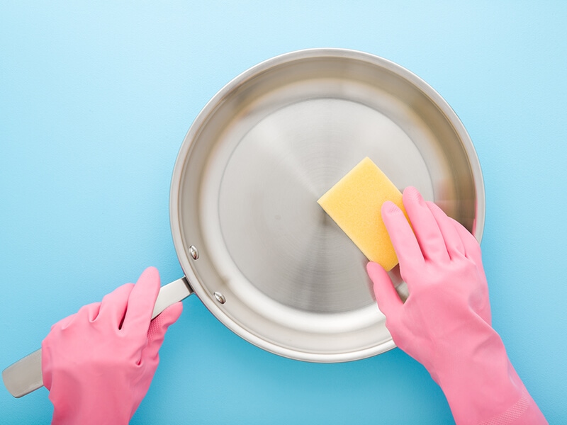 Washing Stainless Frying Pan With Sponge