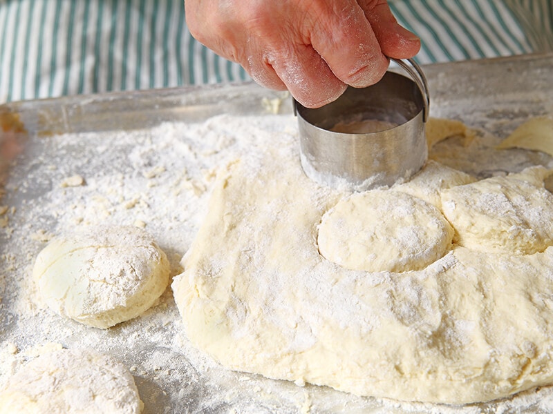 Biscuit Cutters On Floured Pan