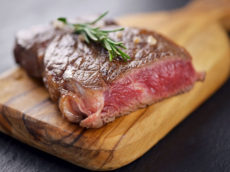 Blue Rare Steak On Cutting Board