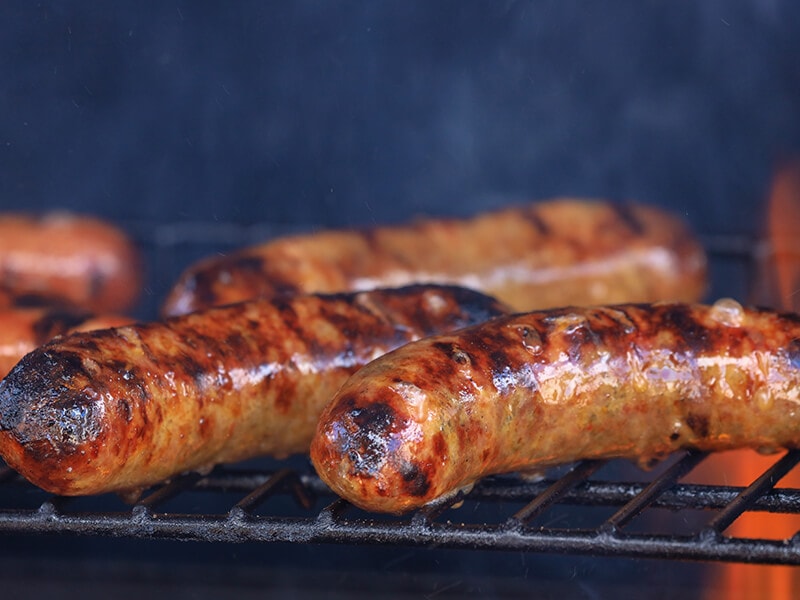 Bratwurst On Charcoal Grill