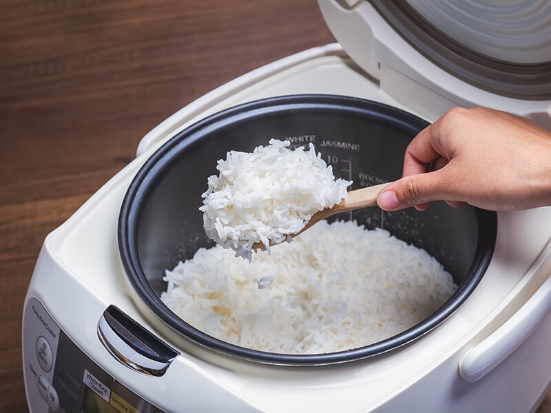 Hand Scooping Jasmine Rice