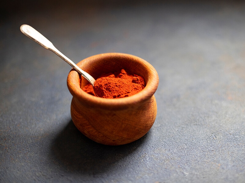 Paprika Powder In Wooden Plate