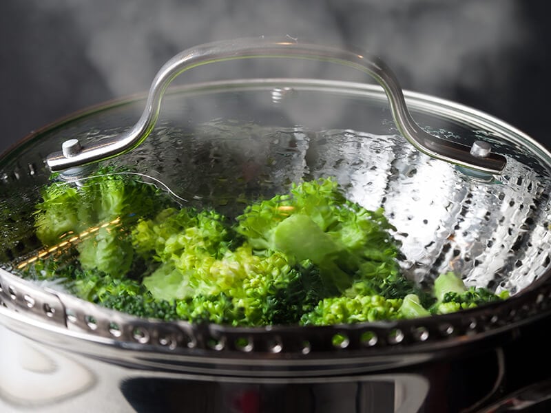 Steamed Green Broccoli In Skimmer Pot