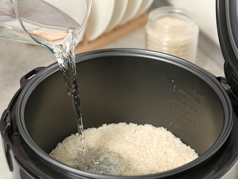 Water Pouring Into Rice Cooker