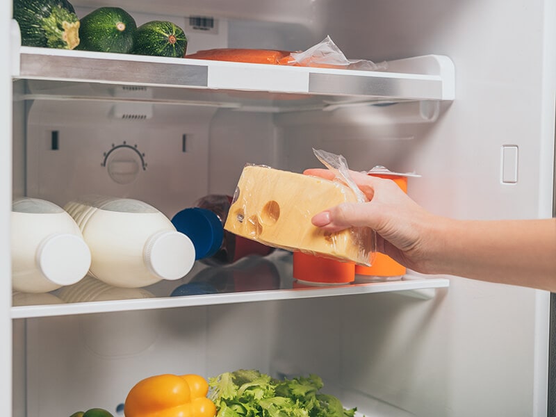 Woman Holding Cheese